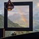 Alpen Tesitin: ecco cosa dicono i nostri ospiti Paesaggio montano con arcobaleno visibile attraverso una cornice della finestra