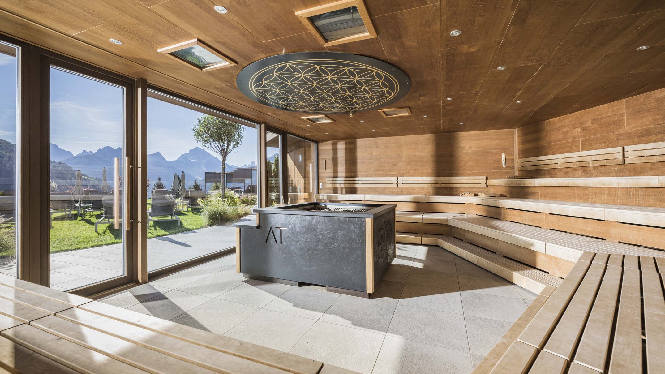 Your 5-star hotel in Val Pusteria/Pustertal: Alpen Tesitin Modern wooden sauna with panoramic windows and mountain view